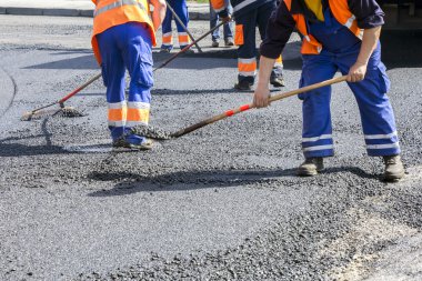 Workers on Asphalting road  clipart