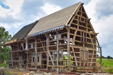 Half-timbered house under reconstruction clipart