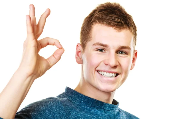 Young man showing ok hand sign gesture — Stock Photo, Image