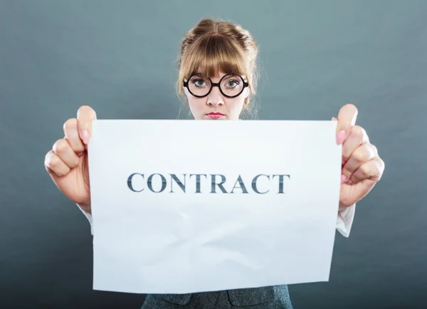 Unhappy business woman showing crumpled contract — Stock Photo, Image