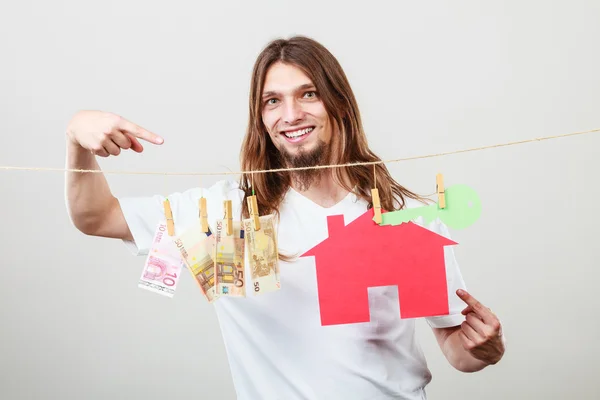 Man seller with money and house — Stock Photo, Image