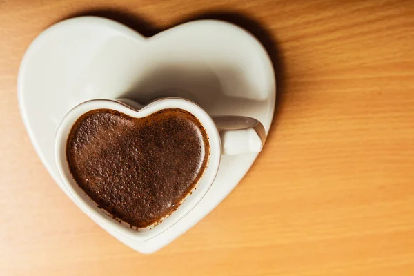 Coffee in heart shaped cup mug. Caffeine energy. — Stock Photo, Image