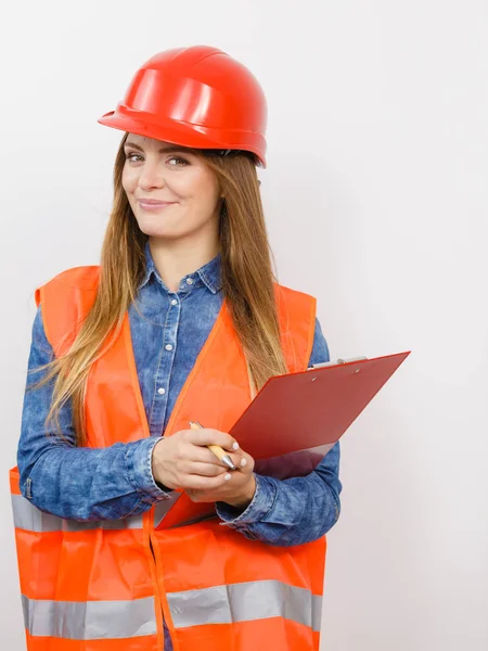 Construction worker holding  file pad — Stock Photo, Image