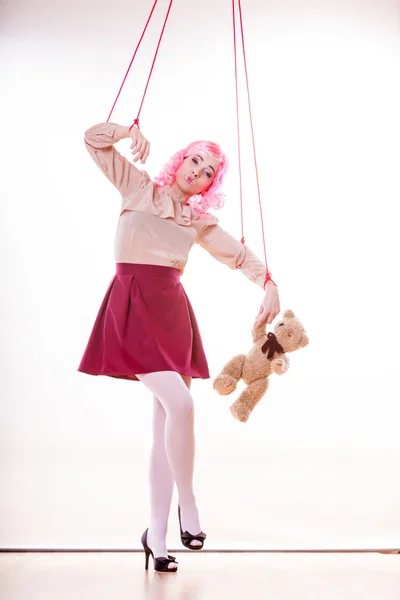 Woman girl stylized like marionette puppet on string — Stock Photo, Image