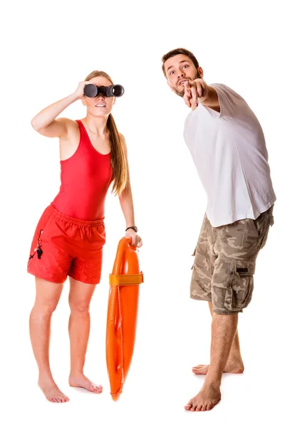 Lifeguards with rescue buoy and binoculars. — Stock Photo, Image