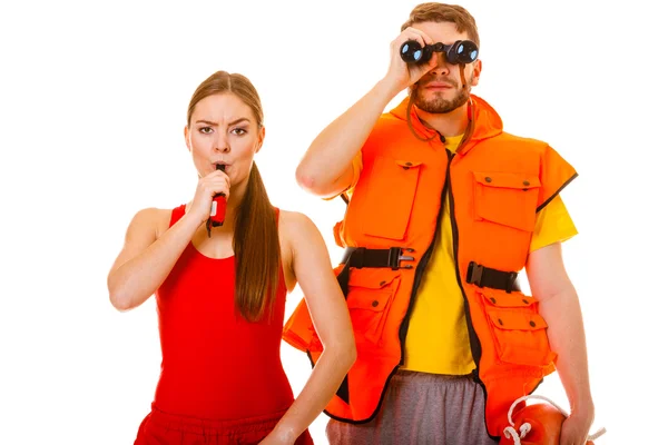 Lifeguards in life vest whistling. — Stock Photo, Image