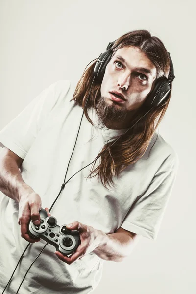 Unhappy male playing games — Stock Photo, Image