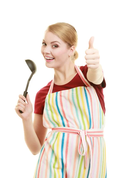 Housewife or cook chef in kitchen apron with ladle — Stock Photo, Image