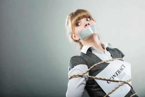Afraid woman bound by contract with taped mouth. — Stock Photo, Image