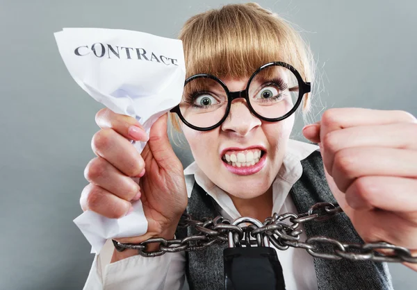 Furious woman with chained hands and contract