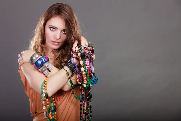 Pretty woman with jewelry necklaces bracelets — Stock Photo, Image