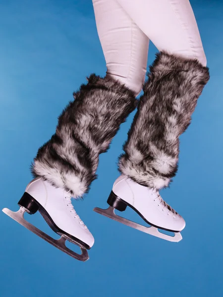 Woman legs wearing ice skates — Stock fotografie