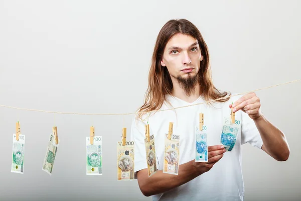 Rich man with laundry of money — Stock Photo, Image