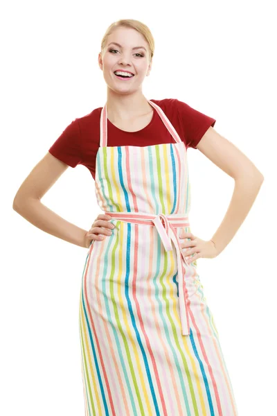 Smiling housewife in kitchen apron — Stock Photo, Image