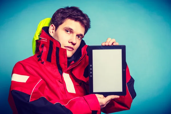 Young man shows tablet with blank space — Stock Photo, Image