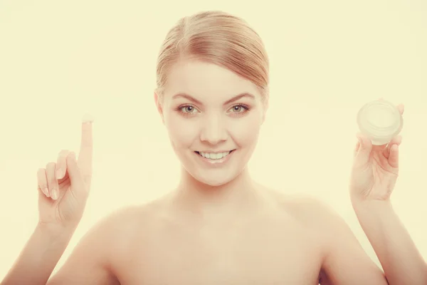 Woman applying cream on her skin face. — Stock Photo, Image