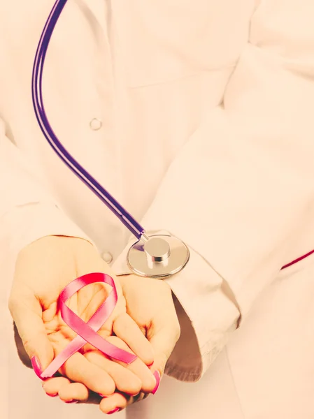 Female hands with pink ribbon — Stock Photo, Image