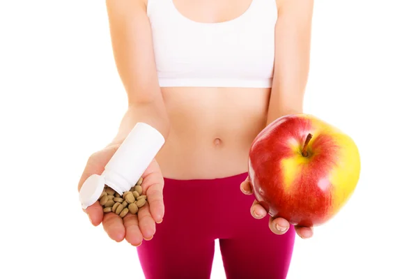 Young woman  holding pills — Stock Photo, Image