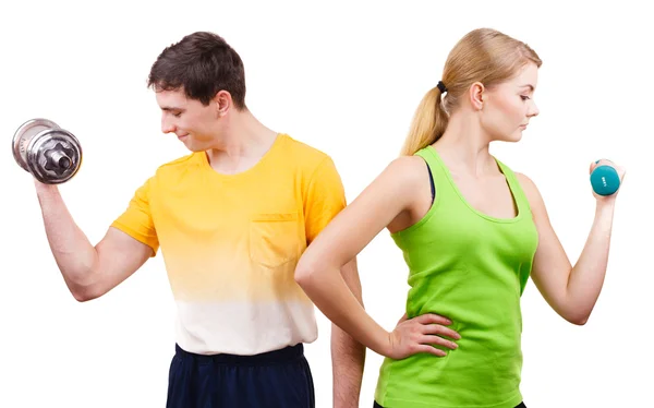 Couple exercising with dumbbells lifting weights — Stock Photo, Image