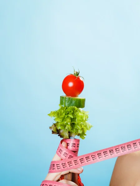 Woman hand with vegetarian food — Stock Photo, Image