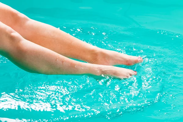 Human legs splashing water. — Stockfoto