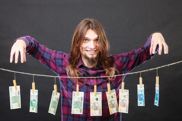 Rich man with laundry of money — Stock Photo, Image