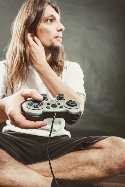 Unhappy male playing games — Stock Photo, Image