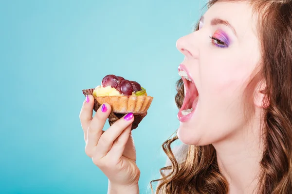 Woman face profile open mouth eating cake — Stock Photo, Image