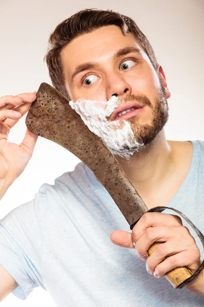 Scared man shaving having fun with machete. — Stock Photo, Image