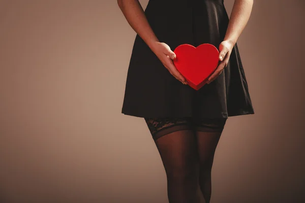 Woman hands holding heart — Stock Photo, Image