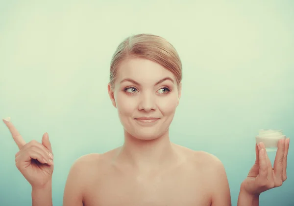 Woman applying cream — Stock Photo, Image