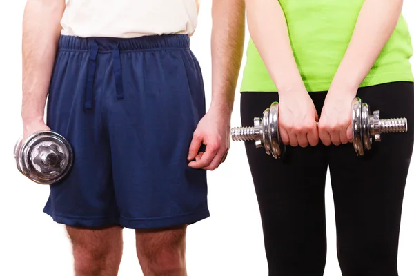 Couple exercising with dumbbells lifting weights — Stock Photo, Image