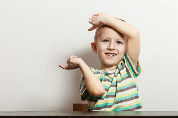 Little boy have fun with funny gestures