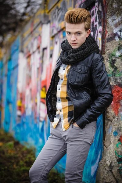 Fashion male portrait on graffiti wall — Stock Photo, Image