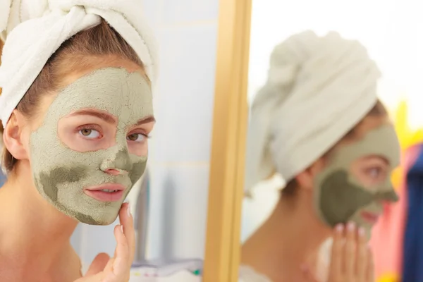 Woman face with green clay mud mask — Stock Photo, Image