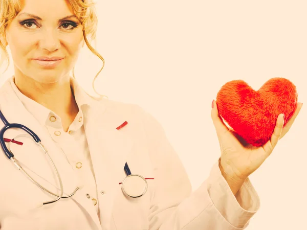 Female cardiologist with red heart. — Stock Photo, Image