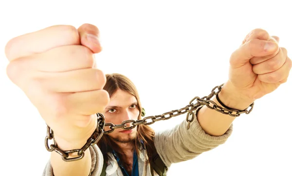 Young man with chained hands. — Stock Photo, Image