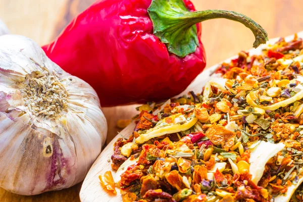 Colored spices for pasta mix on wooden spoon — Stock Photo, Image