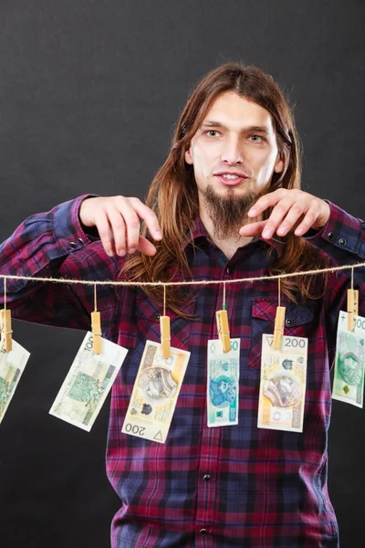 Rich man with laundry of money — Stock Photo, Image