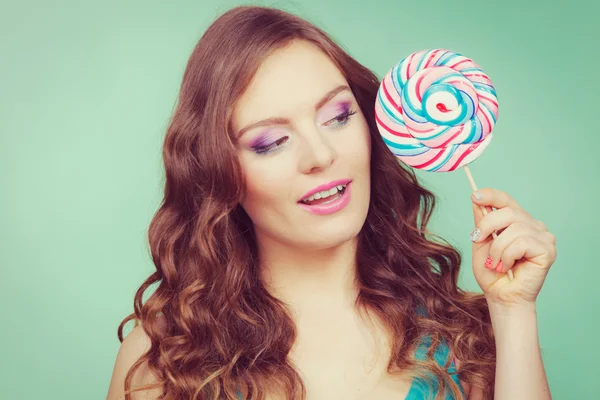 Woman holding colorful lollipop candy — Stock Photo, Image