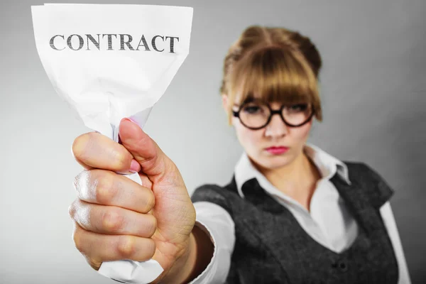 Unhappy business woman showing crumpled contract — Stock Photo, Image