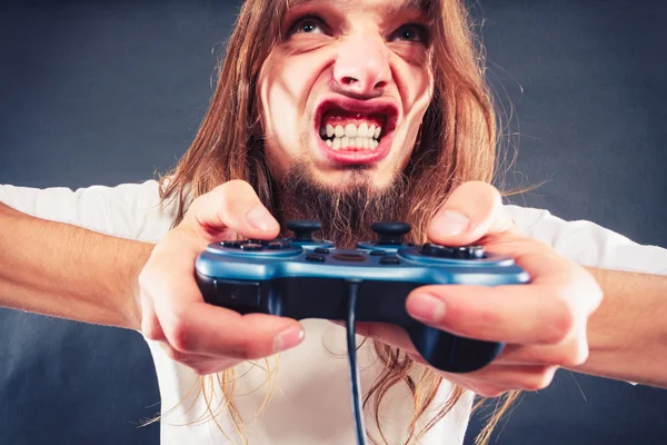 Homem estressado jogando no pad — Fotografia de Stock