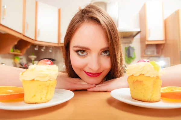 Woman looking at delicious sweet cake. Gluttony. — Stock Photo, Image