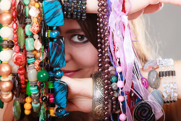 Pretty woman with jewelry necklaces bracelets — Stock Photo, Image
