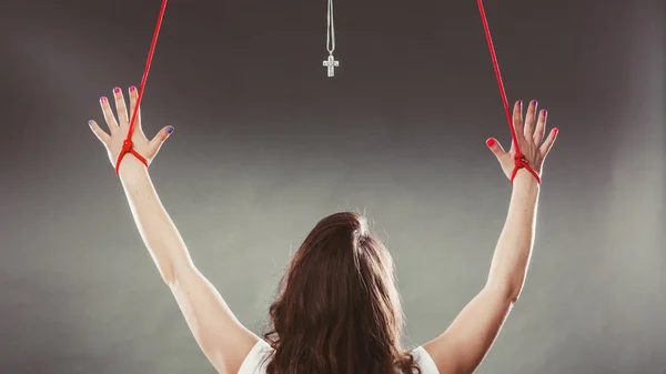 Tied woman forced to worship. Fake faith religion. — Stock Photo, Image