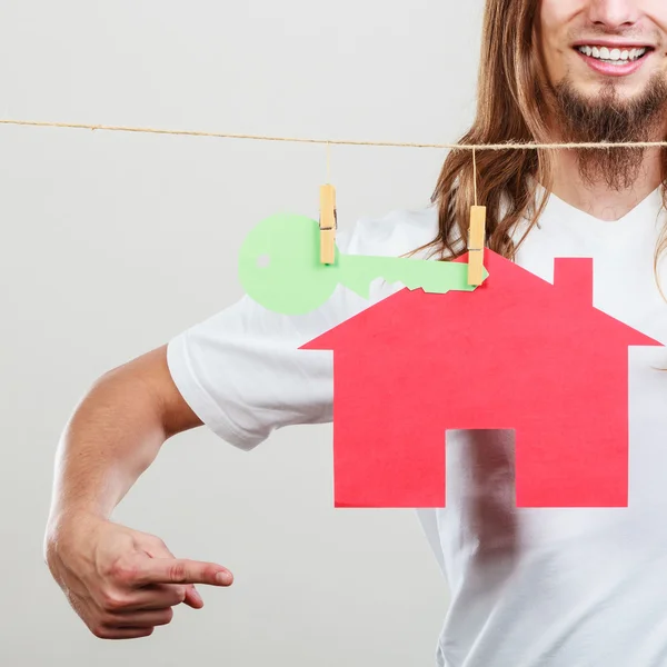 Man seller with house model — Stock Photo, Image