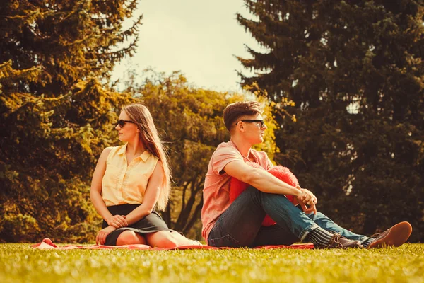 Moody girl with boyfriend in park. — Stock Photo, Image