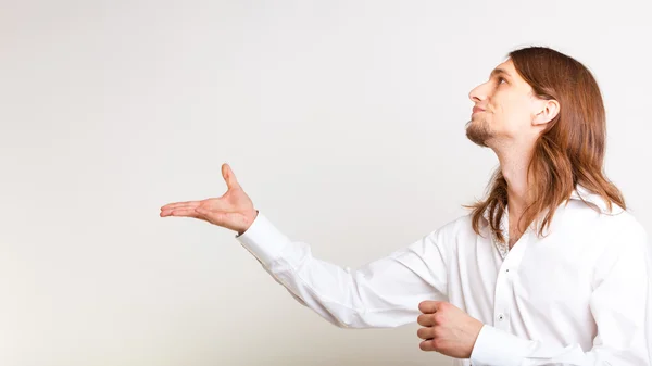 Young man making catching gesture. — Stock Photo, Image