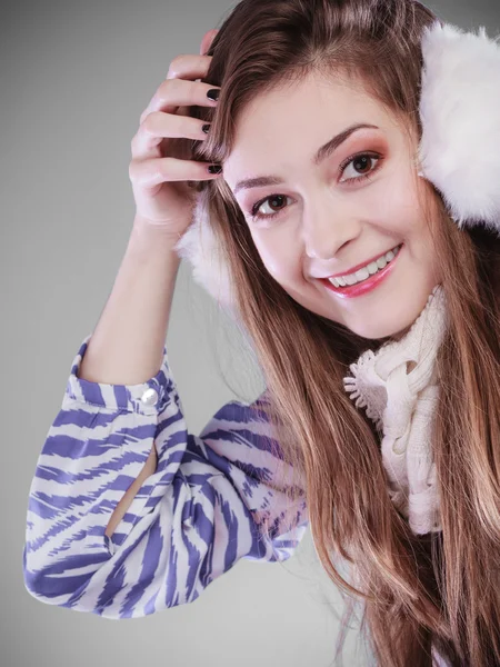 Girl wearing fluffy white earmuffs — Stock Photo, Image