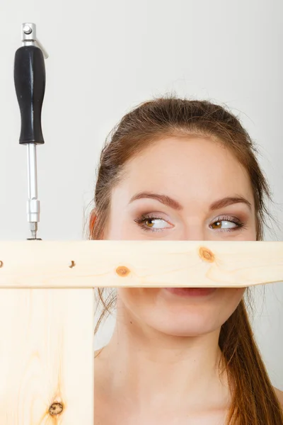 Woman assembling wooden furniture. — Stock Photo, Image